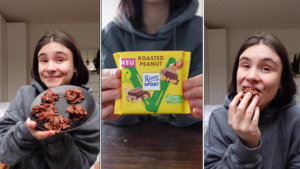 Das Foto zeigt eine junge Frau, die Werbung für Schokolade macht.